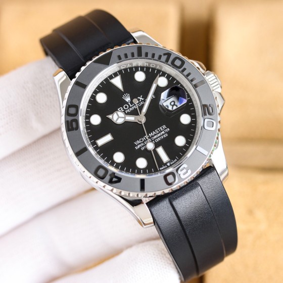Rolex Yacht-Master series, black dial, gray bezel, silver case, 42mm, rubber strap.
