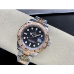 Yacht-Master series, black dial, rose gold bezel, 40mm, two-tone Oyster bracelet.