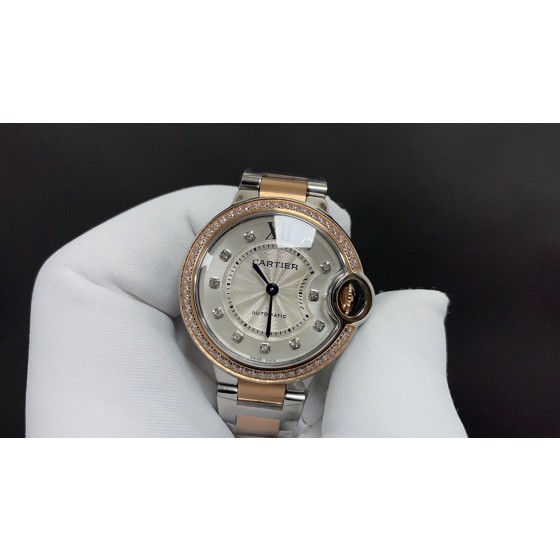 Cartier Ballon Bleu collection, 33mm silver dial with diamonds, rose gold two-tone strap, quartz watch.