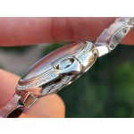 Cartier Ballon Bleu series, 33mm ladies' watch with silver dial and diamond setting, silver strap, mechanical movement.
