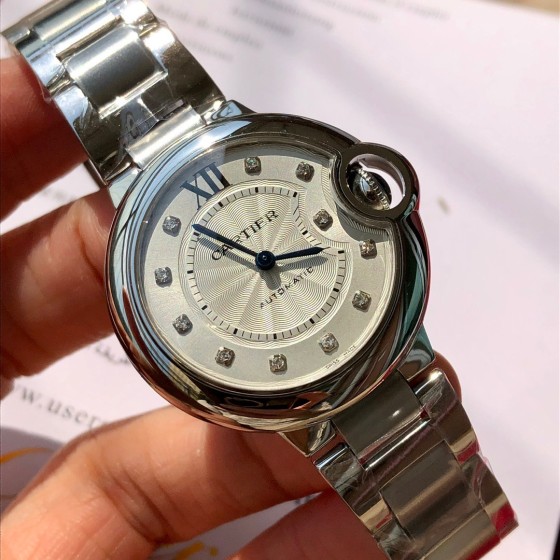 Cartier Ballon Bleu series, 33mm women's watch with silver dial and silver strap, quartz watch.