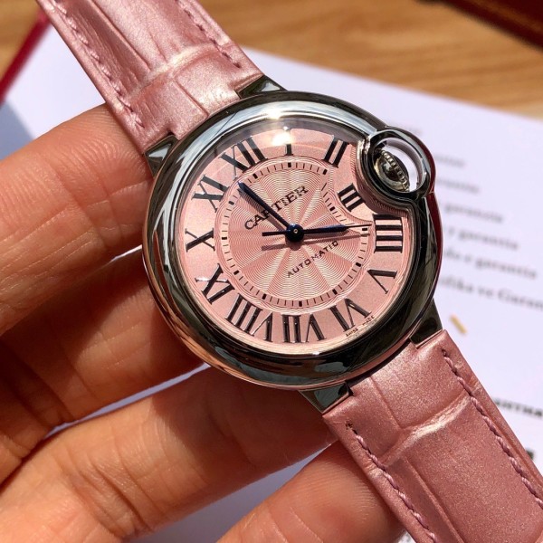 Cartier Ballon Bleu series, 33mm women's watch with pink dial, pink leather strap, mechanical movement.