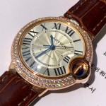 Cartier Ballon Bleu collection, 33mm ladies' watch with silver dial and diamonds, burgundy leather strap, mechanical movement.