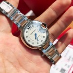 Cartier Ballon Bleu series, 33mm women's watch with silver dial, rose gold two-tone strap, quartz watch.