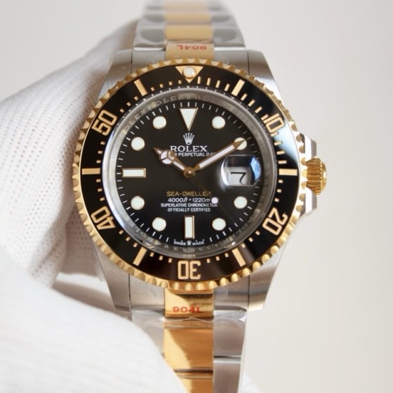 Rolex Sea-Dweller series, black dial, 44mm, silver and rose gold Oyster bracelet.
