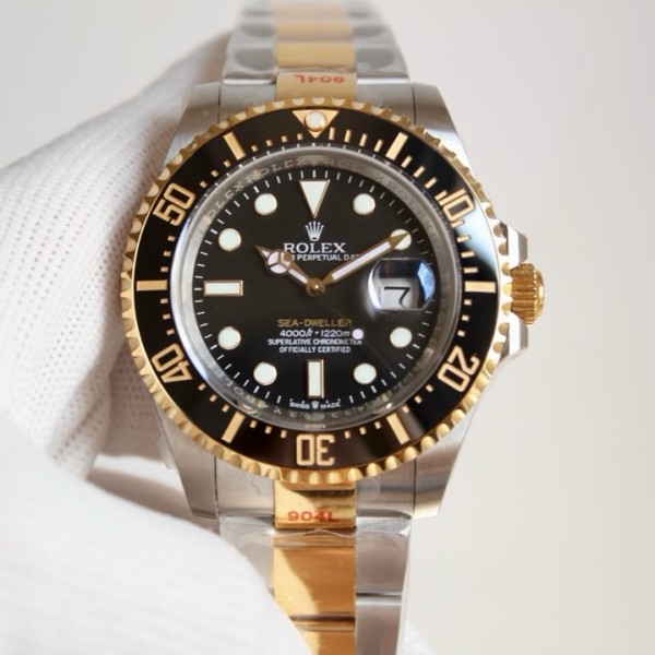 Rolex Sea-Dweller series, black dial, 44mm, silver and rose gold Oyster bracelet.