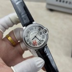 Cartier Ballon Bleu 36mm mechanical women's watch with silver dial, diamond-set bezel, and black leather strap.