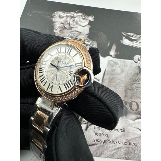 Cartier Ballon Bleu, 33mm, silver dial with diamond-set bezel, two-tone gold and silver.