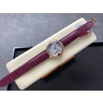 Cartier Ballon Bleu series, 36mm women's watch with silver dial and diamond-set bezel, purple leather strap, mechanical movement.