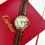 Cartier Ballon Bleu series, 33mm women's watch with silver dial and diamond-set bezel, brown leather strap, mechanical movement.