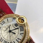 Cartier Ballon Bleu series, 33mm women's watch with silver dial and diamond-set bezel, brown leather strap, mechanical movement.