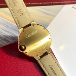 Cartier Ballon Bleu series, 33mm women's watch with silver dial and diamond-set bezel, brown leather strap, mechanical movement.
