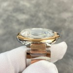 Cartier Ballon Bleu series, 42mm men's watch with silver dial, gold and silver two-tone strap, mechanical movement.