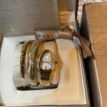 Bulgari Serpentl Collection: White dial with diamonds and gold snake bezel