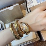 Bulgari Serpentl Collection: White dial with diamonds and gold snake bezel