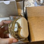 Bulgari Serpentl Collection: White dial with diamonds and gold snake bezel