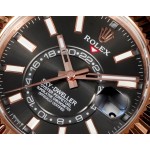 Voyager series men's watch, bright black dial, rose gold bezel, 42mm, rose gold Oyster bracelet.