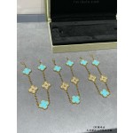 Four-leaf clover gold bracelet with rhinestones and blue accents