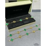 Four-leaf clover gold-interspersed green floral bracelet