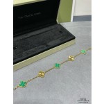 Four-leaf clover gold-interspersed green floral bracelet