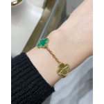 Four-leaf clover gold-interspersed green floral bracelet