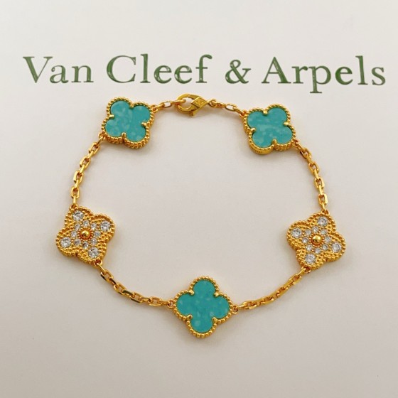 Four-leaf clover light blue and gold diamond-studded bracelet
