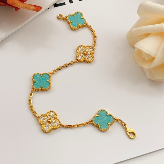 Four-leaf clover light blue and gold diamond-studded bracelet