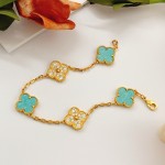 Four-leaf clover light blue and gold diamond-studded bracelet