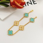 Four-leaf clover light blue and gold diamond-studded bracelet