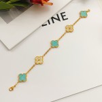Four-leaf clover light blue and gold diamond-studded bracelet