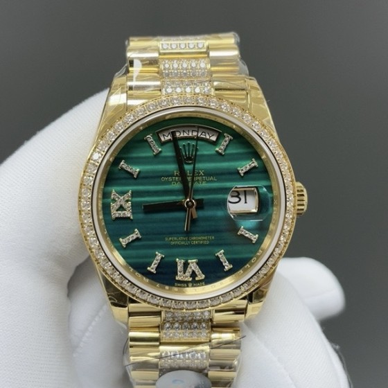 Sunday calendar series women's watch with malachite dial, diamond-set bezel, 36mm case, and diamond-set gold President-style bracelet.