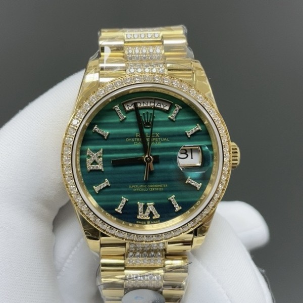 Sunday calendar series women's watch with malachite dial, diamond-set bezel, 36mm case, and diamond-set gold President-style bracelet.