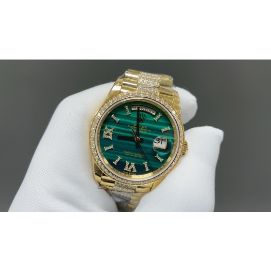 Sunday calendar series women's watch with malachite dial, diamond-set bezel, 36mm case, and diamond-set gold President-style bracelet.